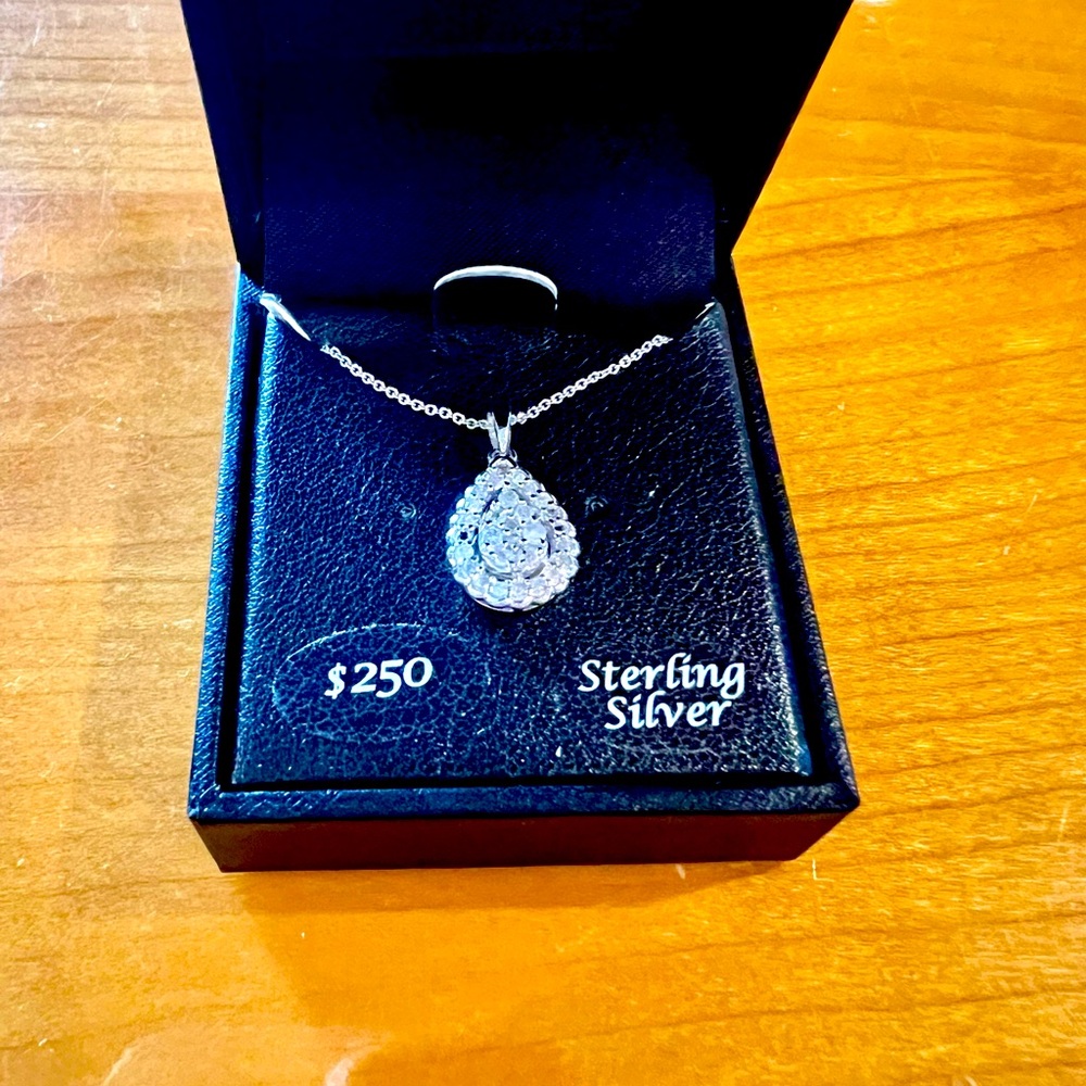 Diamond pendant set in Sterling Silver Sterling Silver chain  1/4 carat total